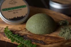 Solid Shampoo bar for Oily Hair placed on the wooden surface with a black background