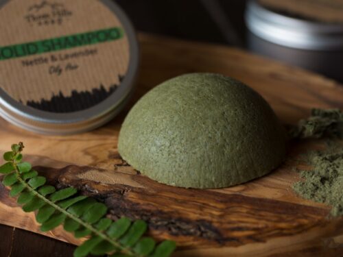 Solid Shampoo bar for Oily Hair placed on the wooden surface with a black background