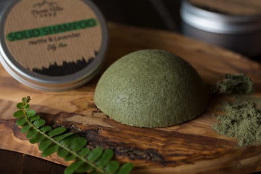 Solid Shampoo bar for Oily Hair placed on the wooden surface with a black background