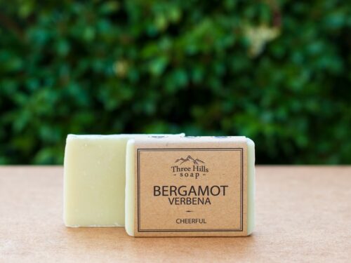 Bergamot Verbena soap bar on wooden surface with natural background
