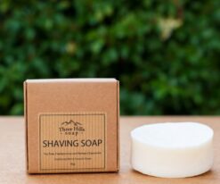 shaving soap in the brown box with a green background