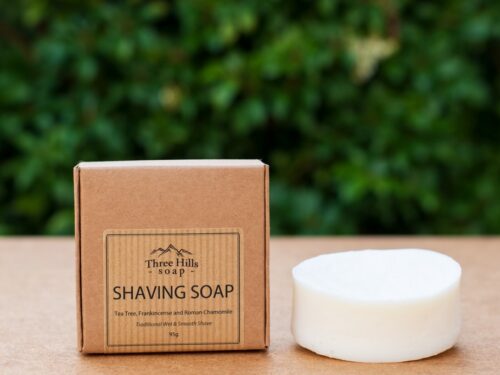 shaving soap in the brown box with a green background