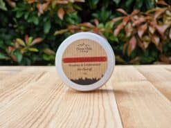 A travel shampoo bar for dandruff in the tin on the wooden surface.